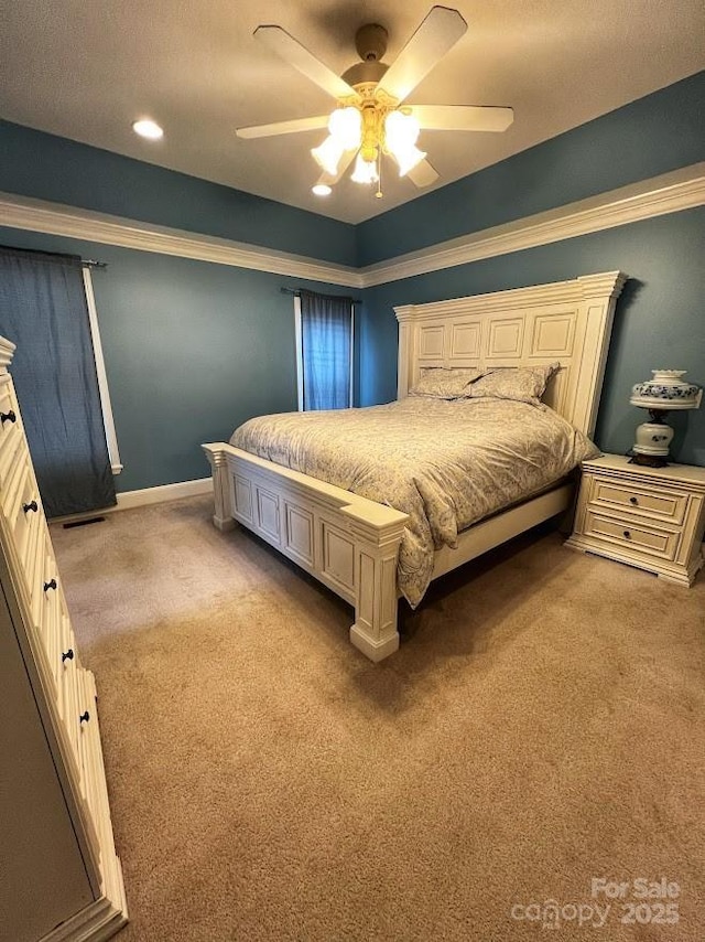 carpeted bedroom featuring ceiling fan