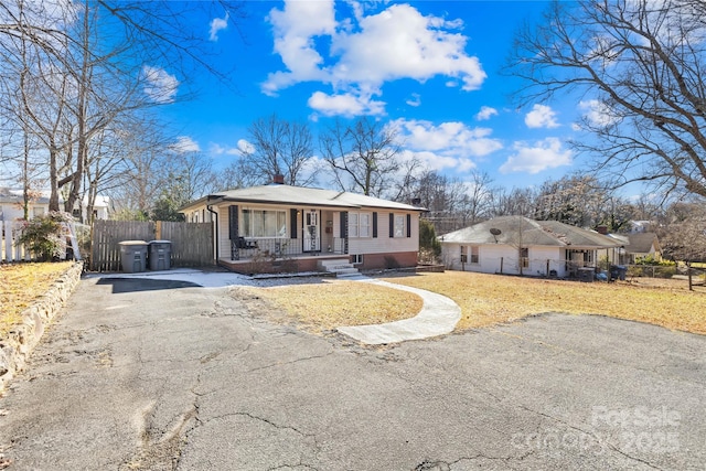 single story home with covered porch