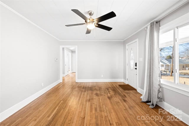 unfurnished room with crown molding, ceiling fan, and light hardwood / wood-style flooring