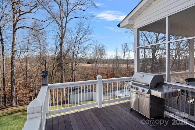 wooden terrace with area for grilling