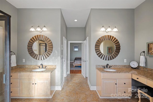 bathroom with tile patterned floors and vanity