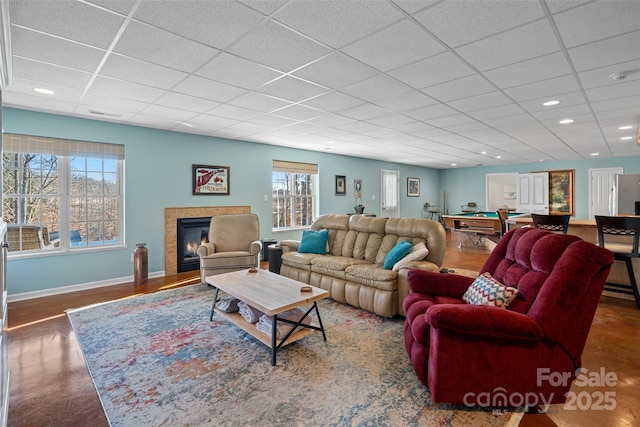 living room with a fireplace, wood-type flooring, plenty of natural light, and pool table