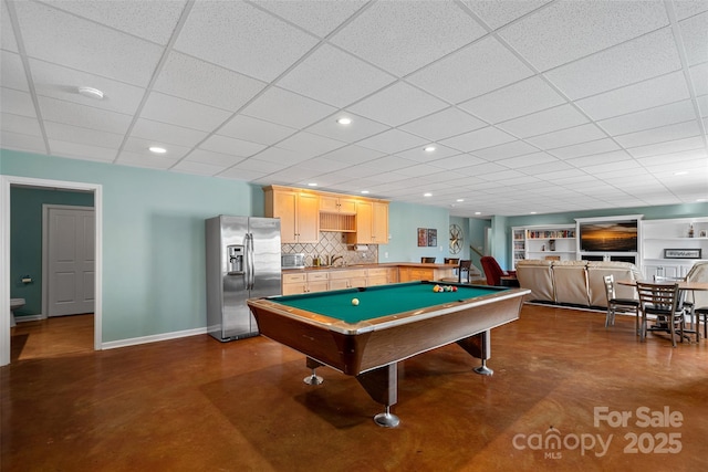 recreation room with pool table, built in features, and a drop ceiling