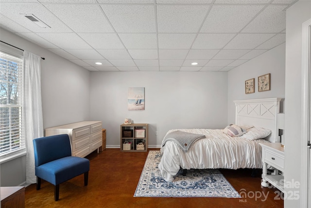 bedroom featuring a paneled ceiling