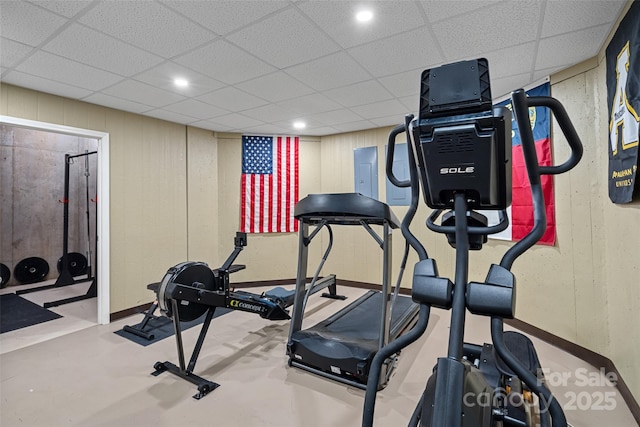 workout area with a paneled ceiling