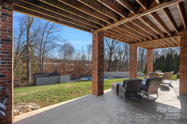 view of patio / terrace featuring a shed