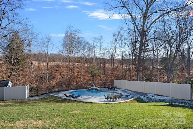 view of yard featuring a fenced in pool and a patio