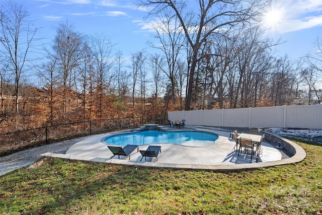 view of pool featuring a patio and a yard