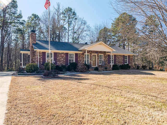 ranch-style house with a front lawn and a porch