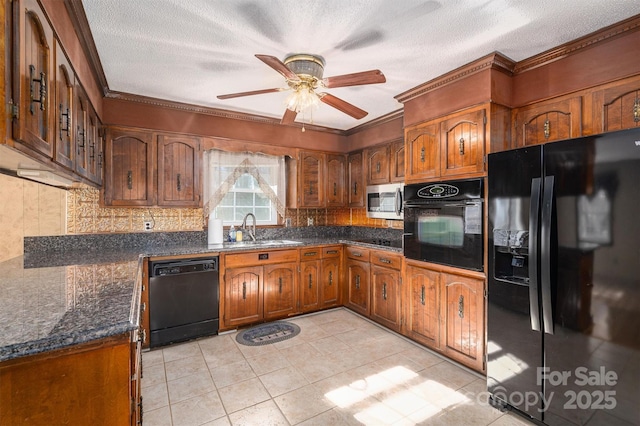 kitchen with a textured ceiling, black appliances, sink, ornamental molding, and light tile patterned floors