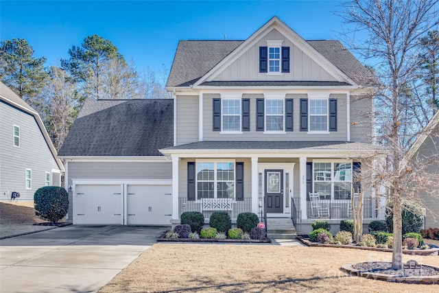 view of front of home featuring a porch and a garage