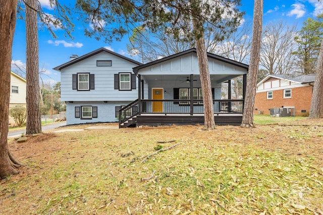 view of front facade with ceiling fan, central AC unit, covered porch, and a front lawn