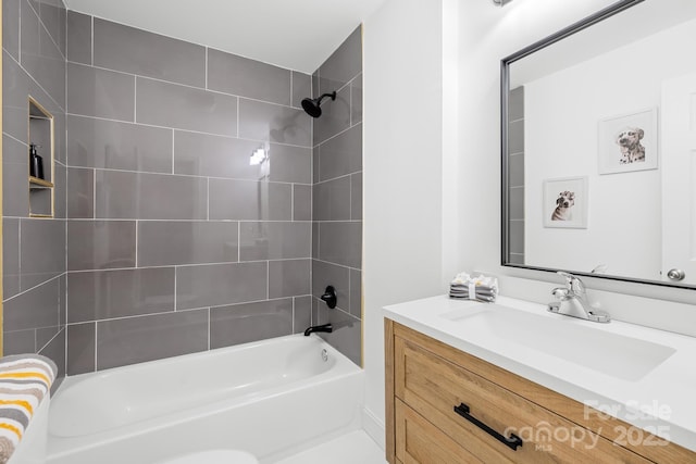 bathroom with vanity and tiled shower / bath combo