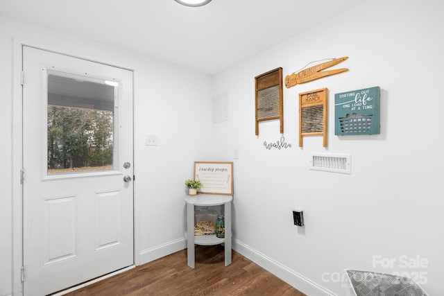 laundry room with dark hardwood / wood-style floors