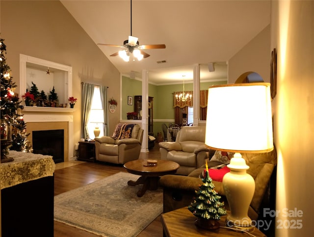 living room featuring high vaulted ceiling, dark hardwood / wood-style floors, and ceiling fan with notable chandelier