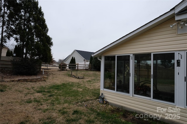 view of yard featuring a sunroom