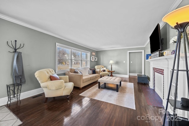 living room featuring crown molding, dark wood-type flooring, and a brick fireplace