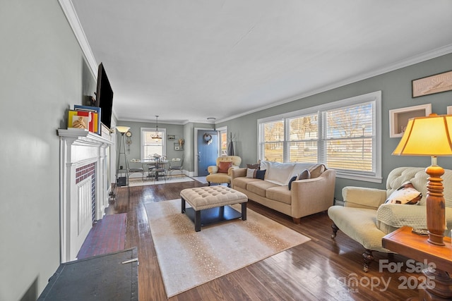 living room with dark wood-type flooring and ornamental molding