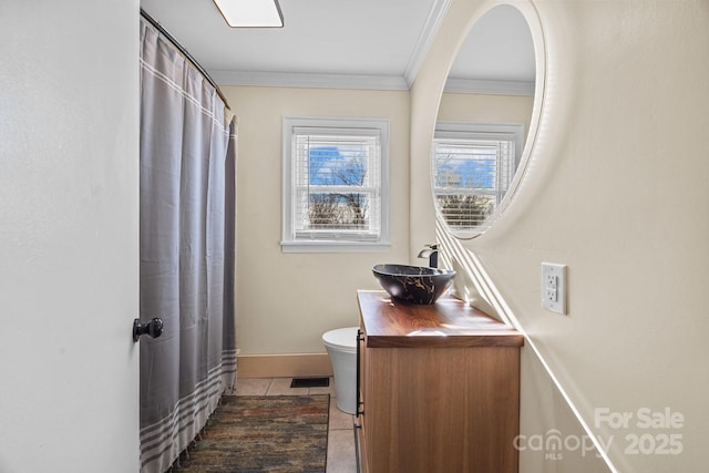 bathroom featuring crown molding, toilet, tile patterned flooring, and vanity