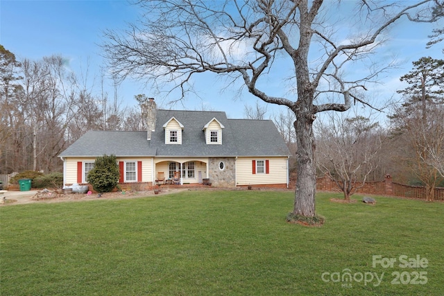 cape cod house featuring a front yard and covered porch