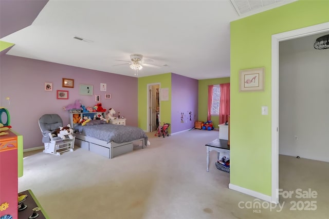 bedroom featuring light carpet and ceiling fan