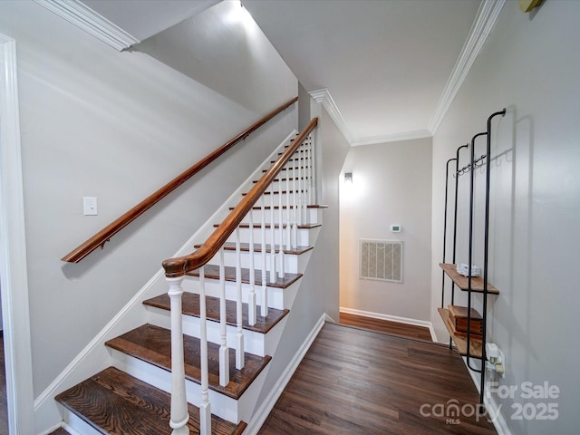 staircase with hardwood / wood-style flooring and ornamental molding