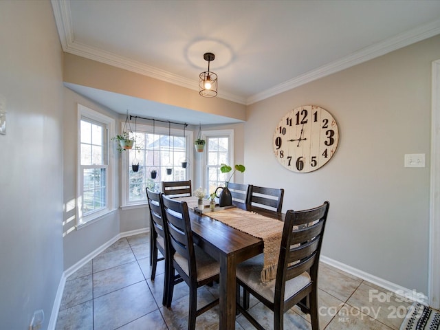 dining space featuring tile patterned floors and ornamental molding