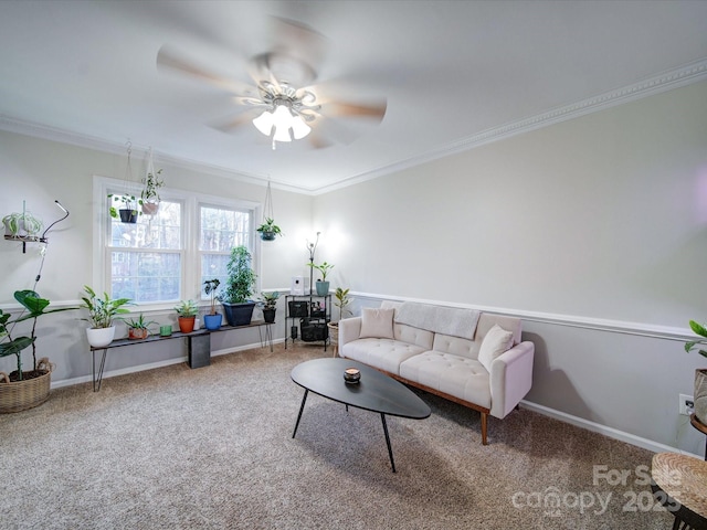 living room with ceiling fan, ornamental molding, and carpet flooring