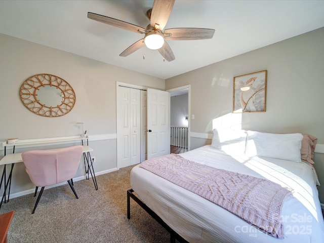 bedroom featuring ceiling fan, a closet, and carpet floors