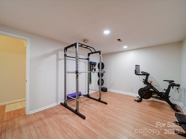 exercise area with wood-type flooring