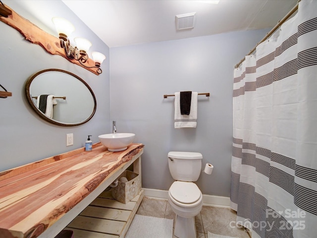 bathroom with toilet and sink