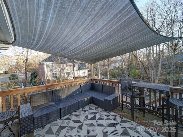 wooden terrace featuring an outdoor living space