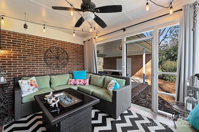 sunroom / solarium featuring ceiling fan