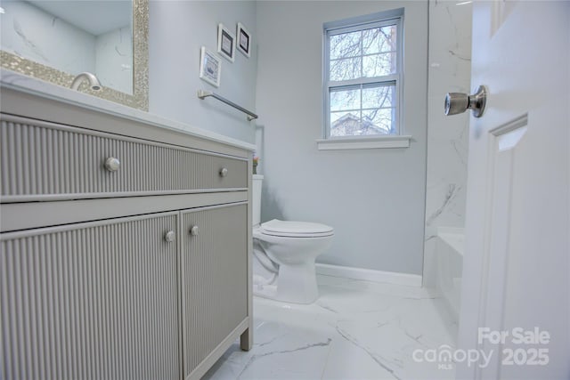 bathroom featuring toilet and vanity