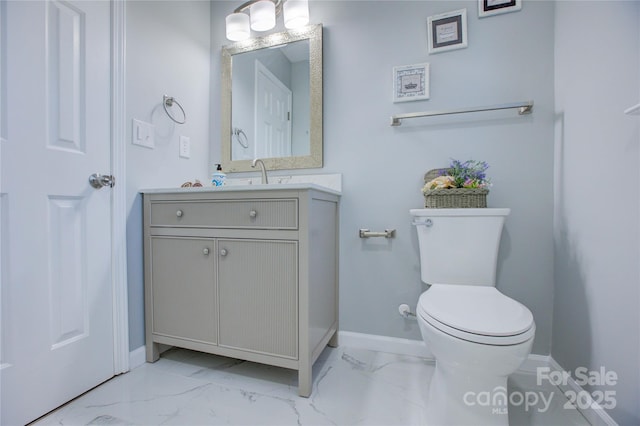 bathroom with toilet and vanity