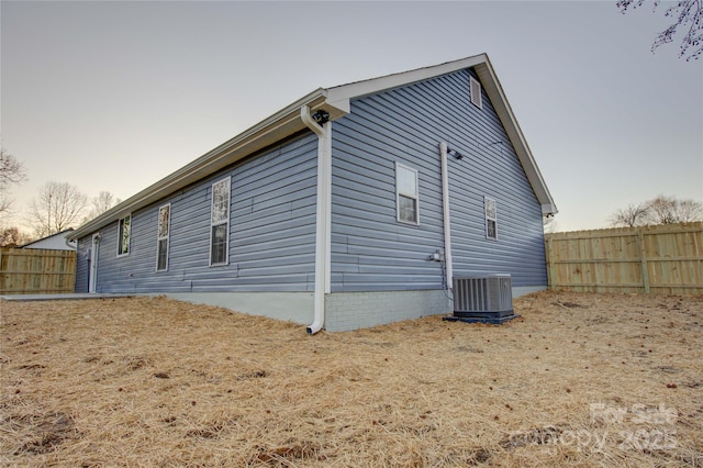 view of side of home featuring cooling unit