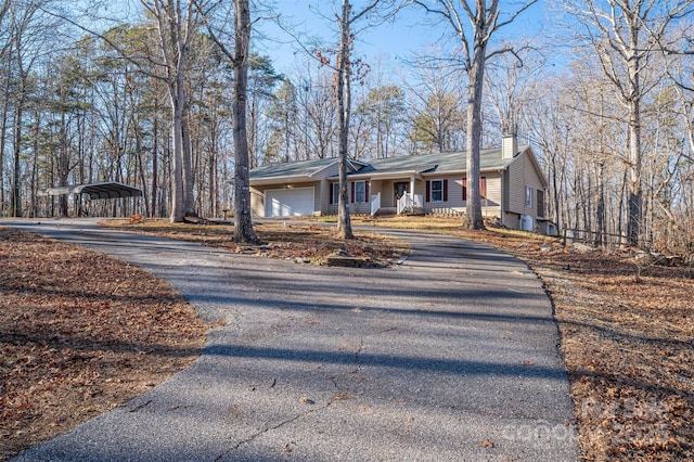 single story home featuring a carport