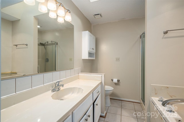 full bathroom with independent shower and bath, tile patterned flooring, vanity, toilet, and a textured ceiling