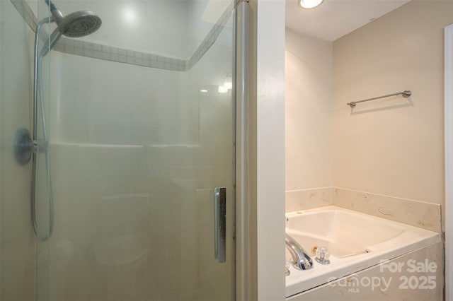 bathroom featuring separate shower and tub