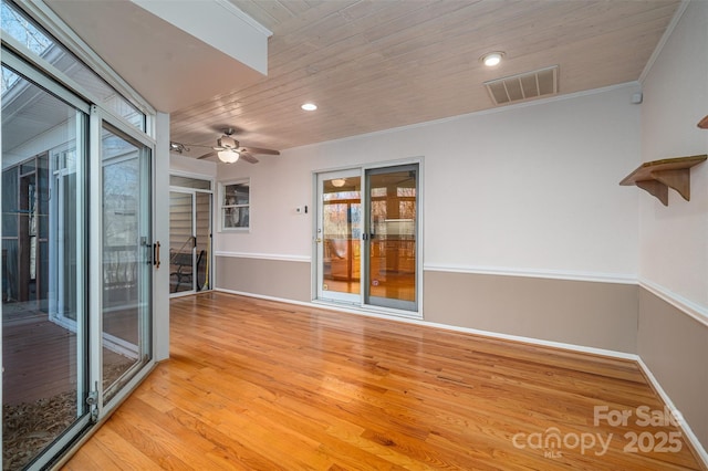 unfurnished room with light hardwood / wood-style flooring, ceiling fan, wood ceiling, and ornamental molding