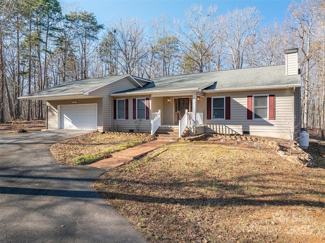 single story home featuring a garage and covered porch