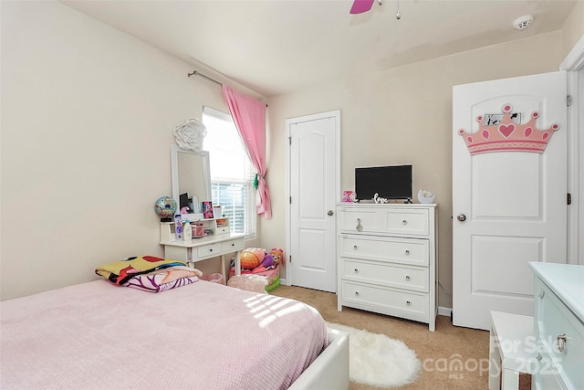 carpeted bedroom featuring ceiling fan