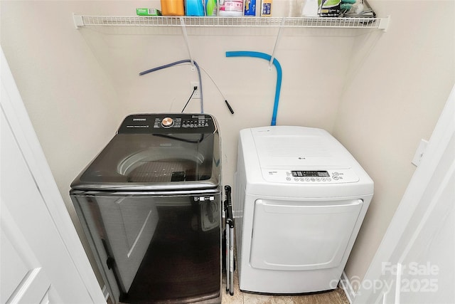 washroom featuring washer and dryer