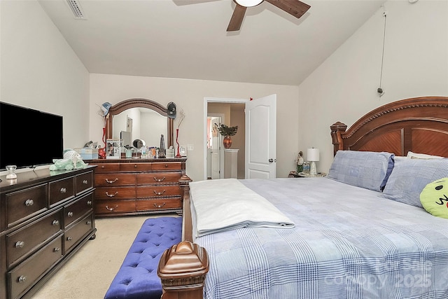 bedroom featuring ceiling fan, lofted ceiling, and light colored carpet