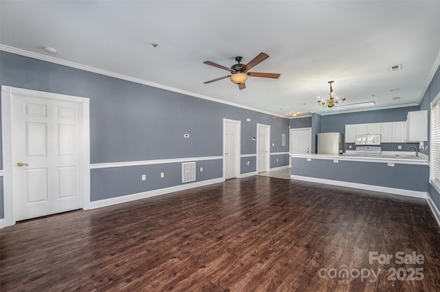 unfurnished living room with sink, dark hardwood / wood-style flooring, and ornamental molding