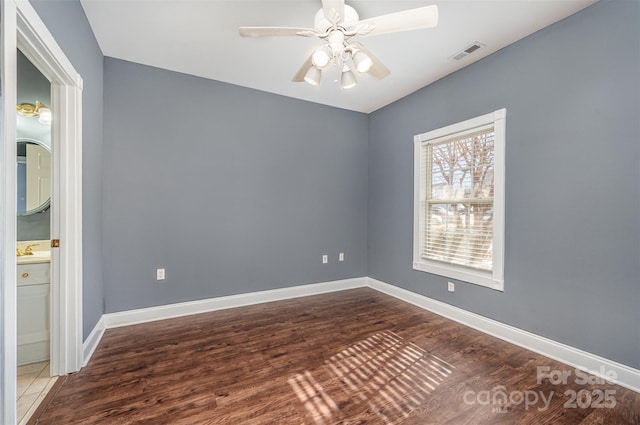 unfurnished room featuring ceiling fan and wood-type flooring