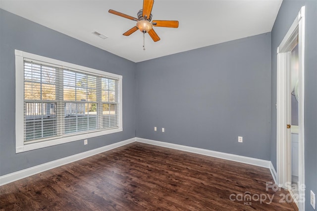 spare room featuring hardwood / wood-style flooring and ceiling fan