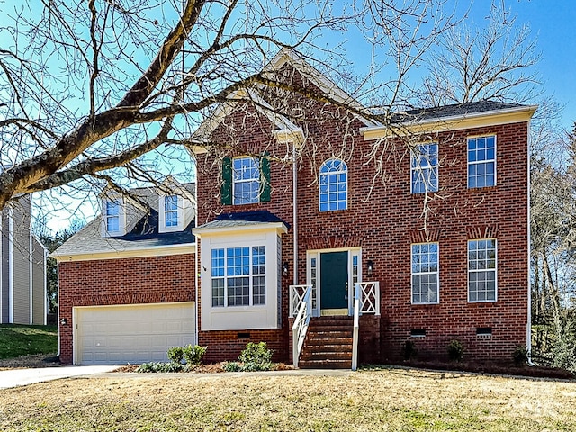 view of front of house featuring a garage and a front yard