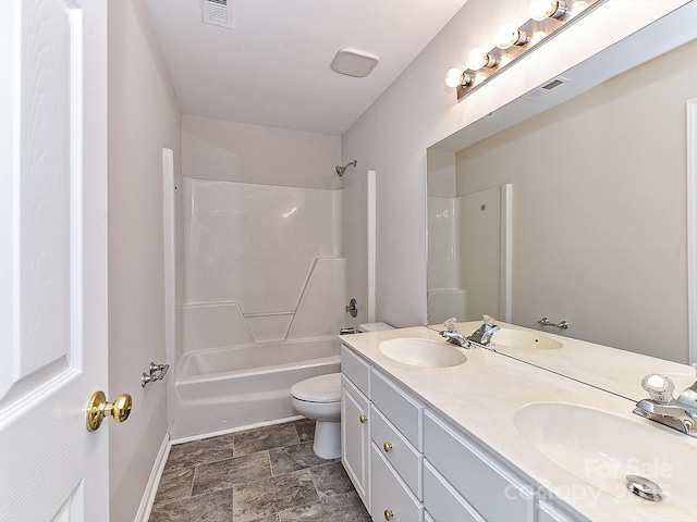 full bathroom featuring toilet, vanity, and  shower combination