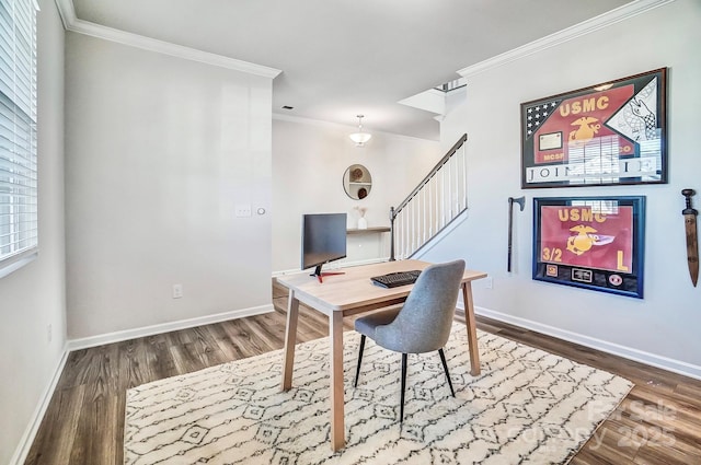 office area featuring baseboards, wood finished floors, and ornamental molding